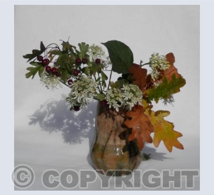 Stoneware vase with autumn leaves