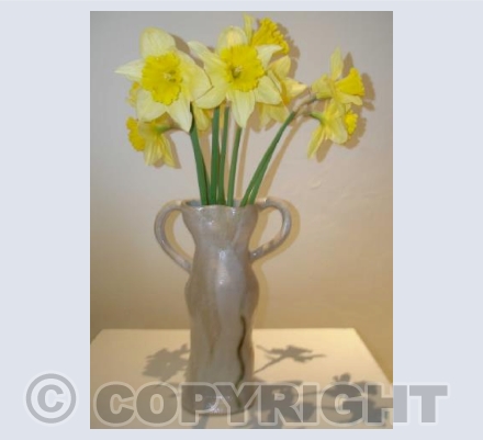 White vase with daffodils